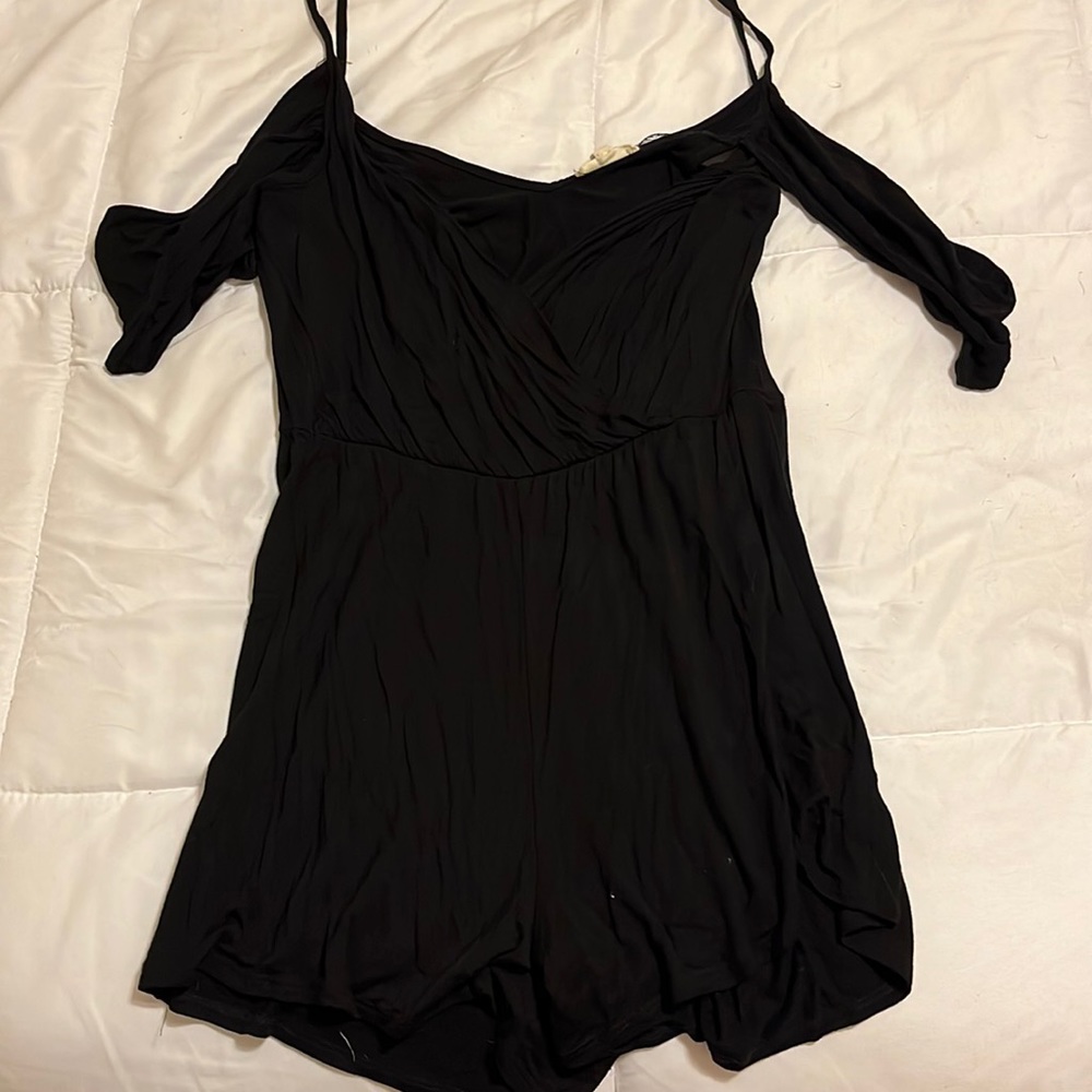 Black romper with spaghetti straps and off the shoulder sleeves!